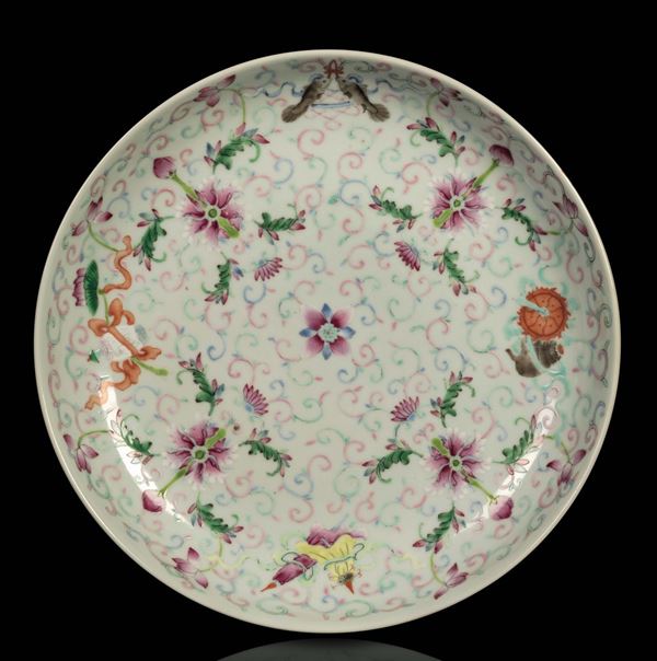 A polychrome enamelled porcelain dish with lotus flowers, China, Qing Dynasty, 19th century
