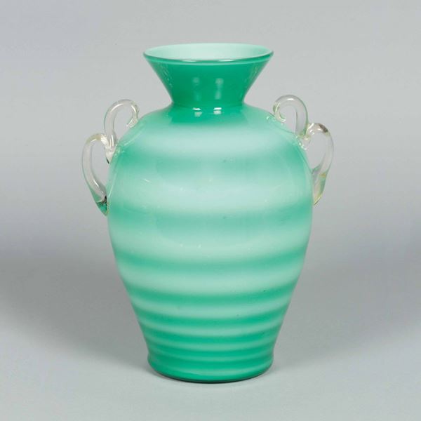 Flavio Poli, 1937 ca. An ovoidal glass vase with a flared neck, applied handles and a stamped band decor.