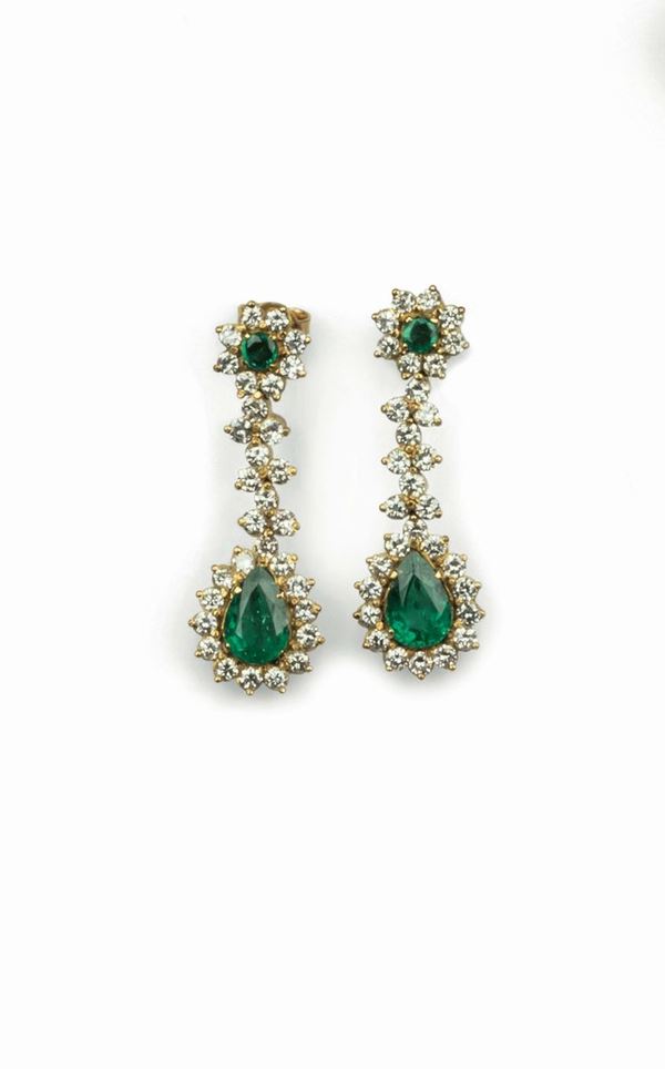 Pair of emerald and diamond earrings set in white and yellow gold