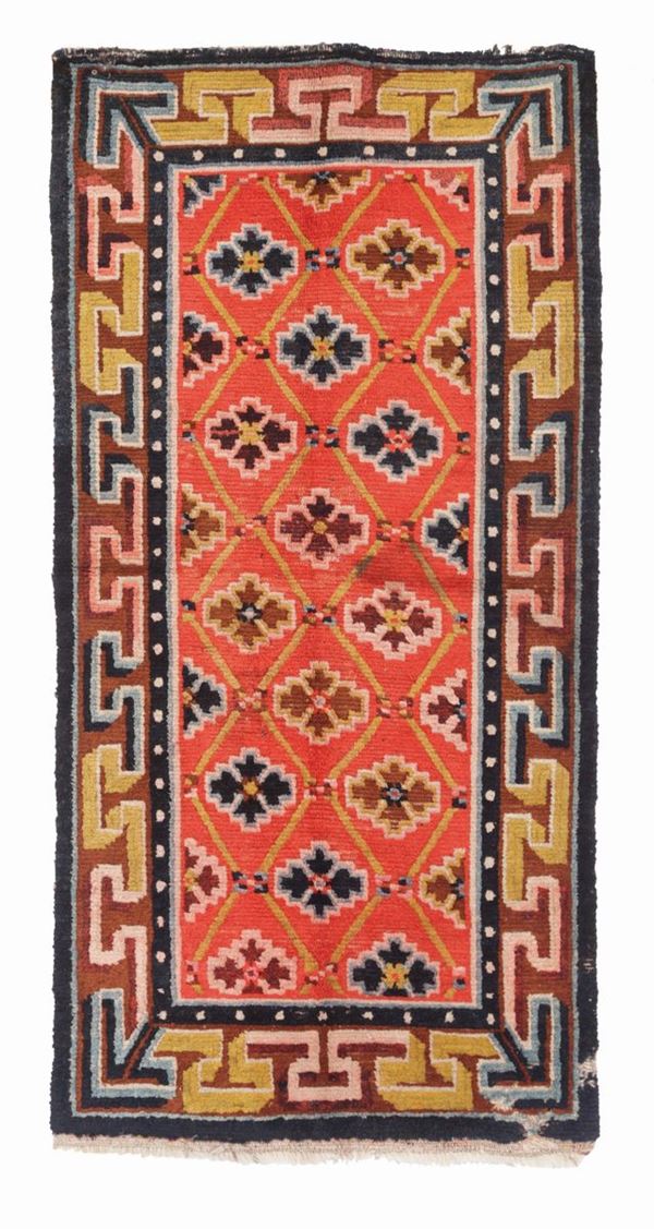A Tibetan rug, early 20th century