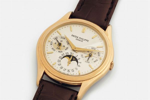 PATEK PHILIPPE REF.3940 PERPETUAL CALENDAR YELLOW GOLD, Ref. 3940J, case No. 2941999. Very fine and rare, self-winding, 18K yellow gold wristwatch with perpetual calendar, moon phases, 24 hour indication, leap year indication and an 18K yellow gold Patek Philippe buckle. Sold in 1993. Accompanied by the original box, push pin, Exctract and additional case back.