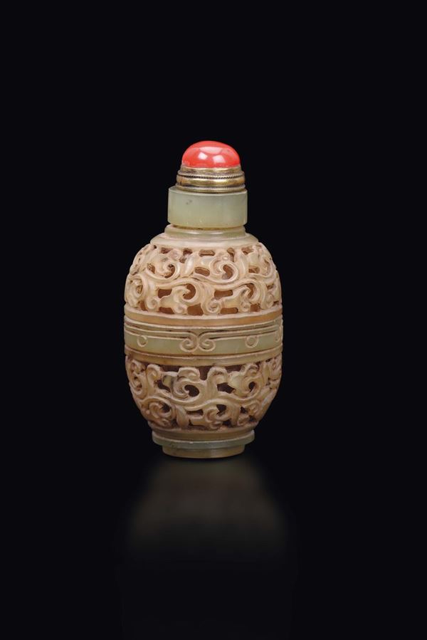 A fretworked Celadon white jade snuff bottle, China, Qing Dynasty, 19th century