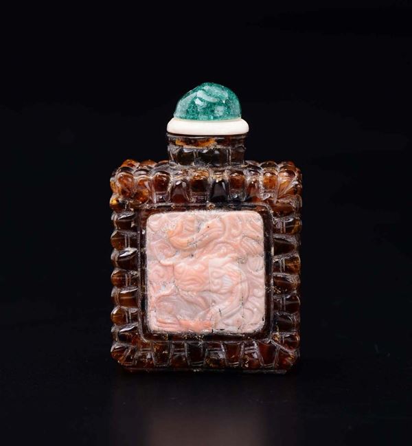 An amber snuff bottle with coral inlays, China, Qing Dynasty, 19th century