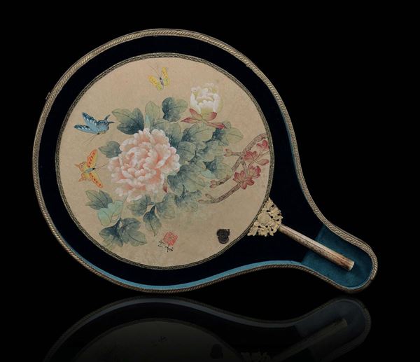A painted fan with flowers and a not coeval landscape, with carved ivory and bone handle, China, Qing Dynasty, 18th/19th century