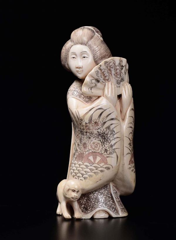 A carved ivory figure of Geisha with fan, Japan, Meiji Period, late 19th century