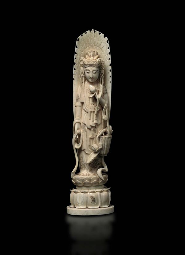 A carved ivory figure of goddess with aura on lotus flower, China, early 20th century
