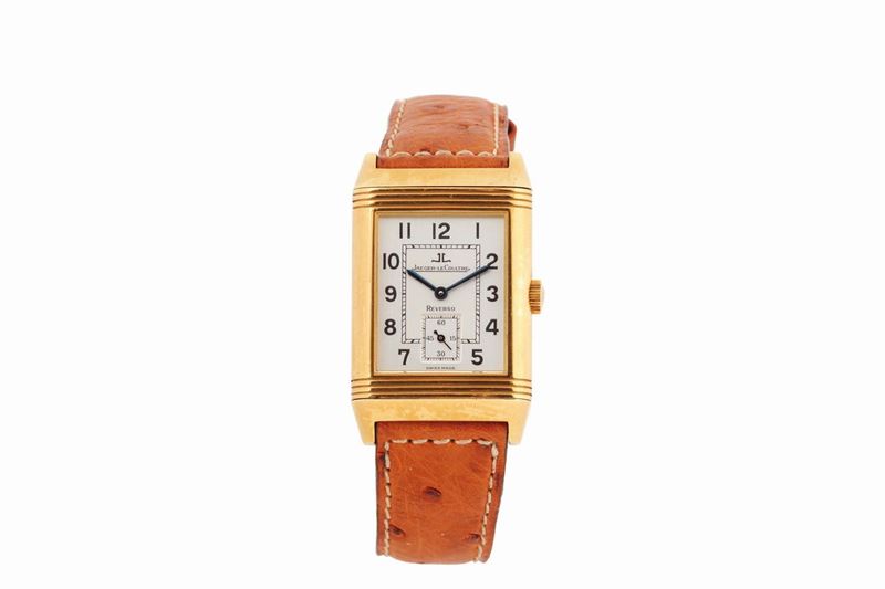 JAEGER-LECOULTRE, GRAND TAILLE,  REF. 270.1.62.  Made circa 1990. Fine and rare, rectangular and reversible, 18K yellow gold wristwatch with an 18K yellow gold Jaeger- LeCoultre buckle.  Accompanied by the original box and Guarantee  - Auction Watches and Pocket Watches - Cambi Casa d'Aste