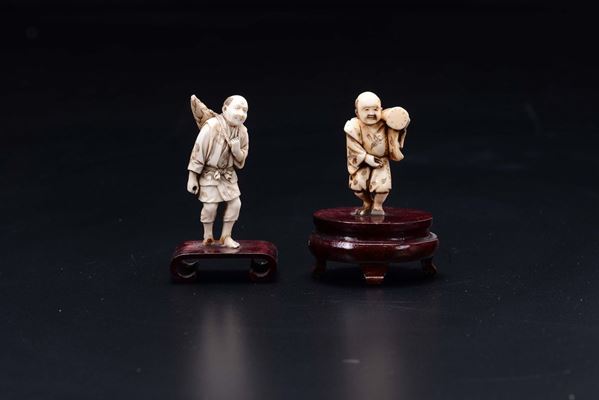 Two carved ivory figures of peasants, Japan, early 20th century