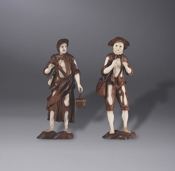 A pair of wooden and ivory figures of beggars, Germany, 18th century
