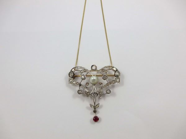 Diamond and pearl pendant set in gold and silver
