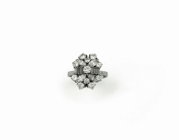 Round-cut and navette-cut diamond ring mounted in white gold