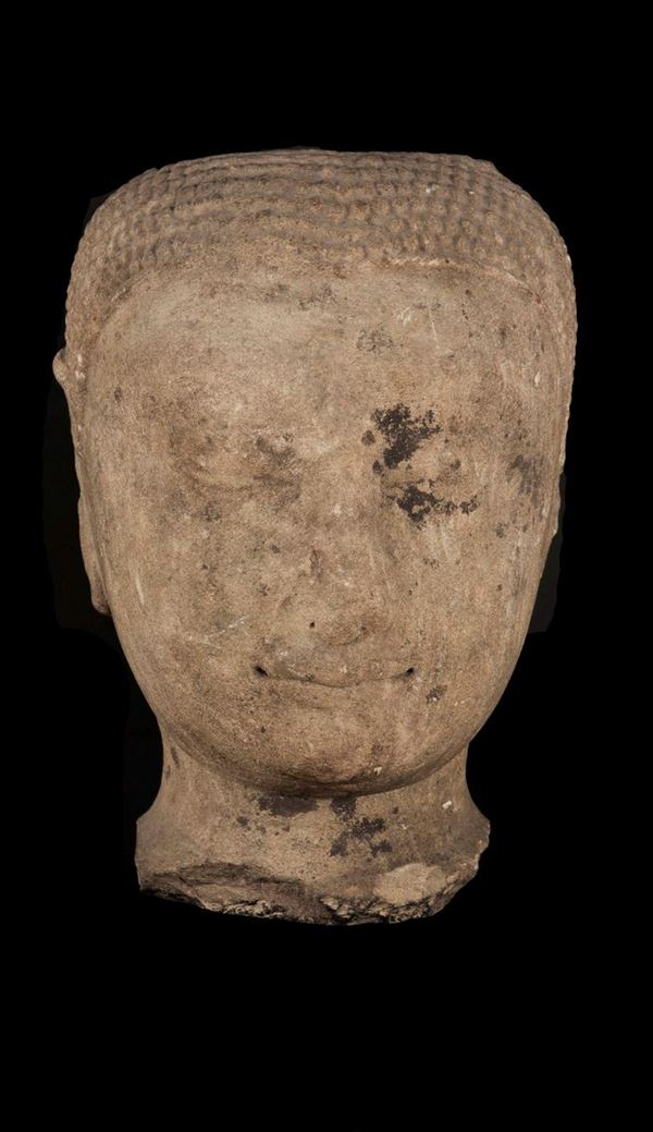 A carved stone Buddha's head, Thailand, 16th century