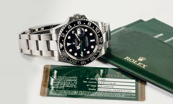 ROLEX, Oyster Perpetual Date, GMT-MASTER II, Superlative Chronometer Officially Certified, case No. V534509, Ref. 116710, Ceramic Bezel. Fine, water-resistant, self-winding, center seconds, two time zone, stainless steel wristwatch with date, special 24-hour ceramic bezel and hand, independently adjustable hour hand and a stainless steel Oysterlock bracelet. Accompanied by the original box, guarantee,  booklets and additional links. Sold in 2009