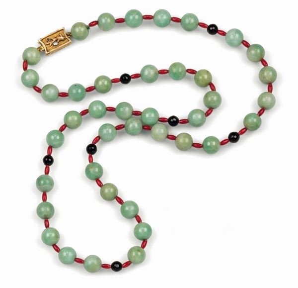 Art deco jadeite necklace with coral and onyx. Gold, sapphire and diamond clasp. Signed Fontana