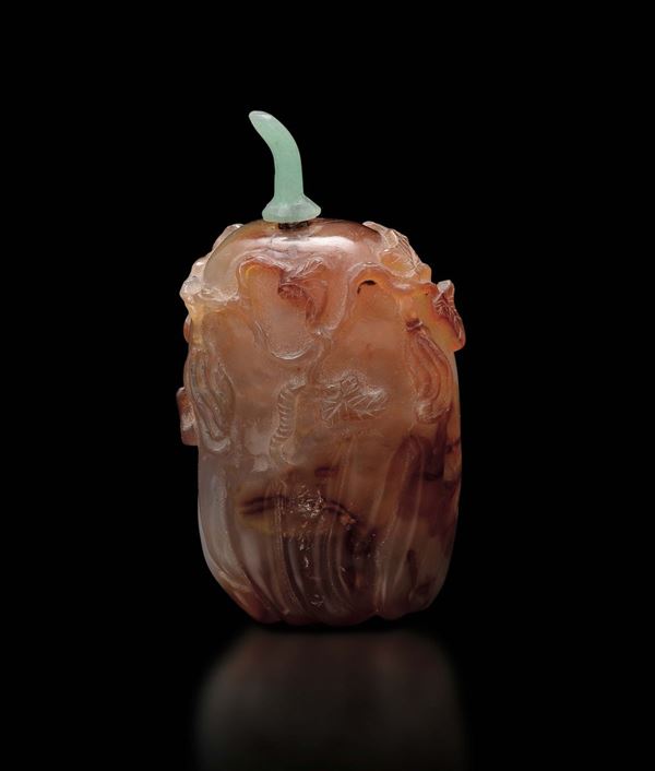 A carnelian fruit-shaped snuff bottle with branches in relief, China, Qing Dynasty, 19th century