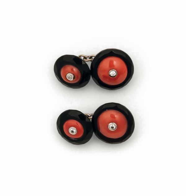 Pair of coral and onyx cufflinks set in white gold