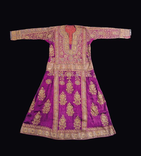 A violet-ground silk dress embroidered with golden and silver thread, India, 19th century