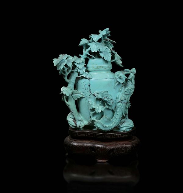 A small turquoise vase and cover with branches and peacock in relief, China, early 20th century