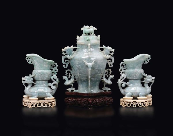 A jadeite triptyque: a vase with dragons and two mythical beast with vase on their back with ivory stands, China, early 20th century