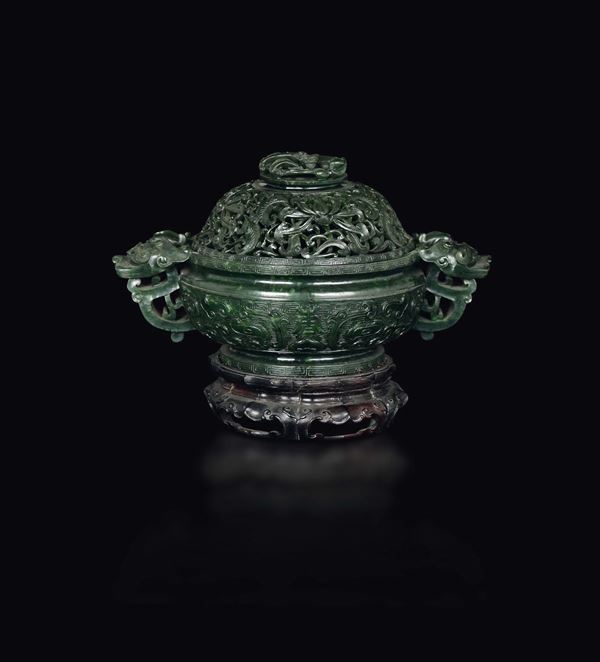 A fretworked spinach green jade cup and cover with an archaic style motif, China, Qing Dynasty, Qianlong Period (1736-1795)