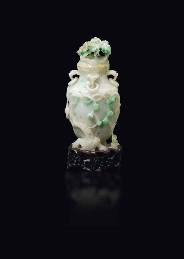 A small apple green shades jadeite vase and cover with grapes, China, early 20th century