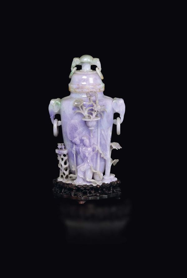 A large lavender and apple green shades jadeite vase and cover with elephant-heads handles and Guanyin with child in relief, China, early 20th century
