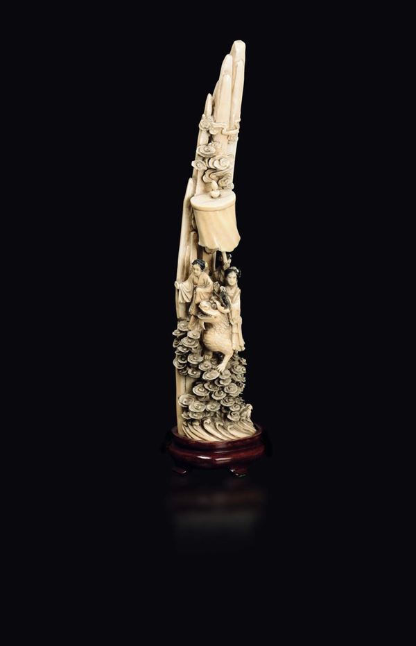 A carved ivory group with three Guanyin and a Pho dog, China, Qing Dynasty, late 19th century