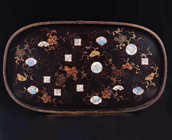 A lacquered wood tray with porcelain inleys, China, early 20th century