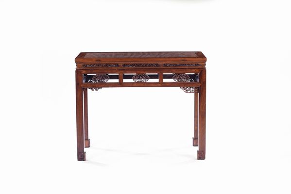 A fretworked wood table, China, Qing Dynasty, 19th century