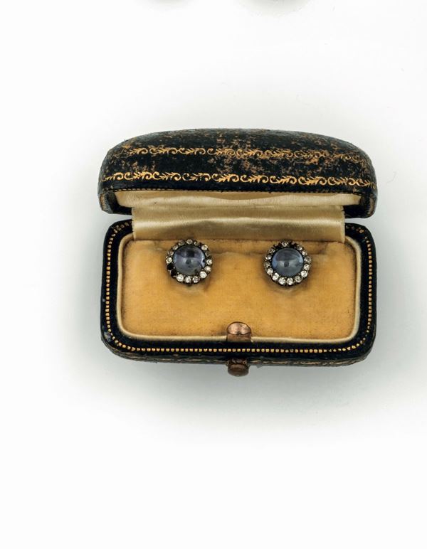 Pair of cabochon-cut sapphire cufflinks. Fitted case