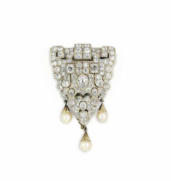 Platinum and diamond clip. Pearls are not pertinent