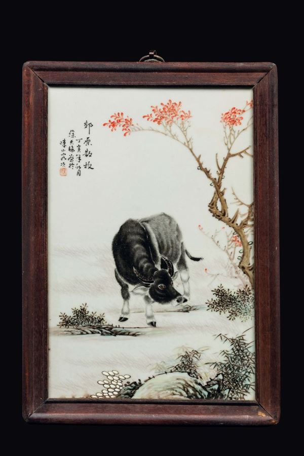 A polychrome enamelled porcelain plaque with buffalo and inscription, China, Republic, 20th century
