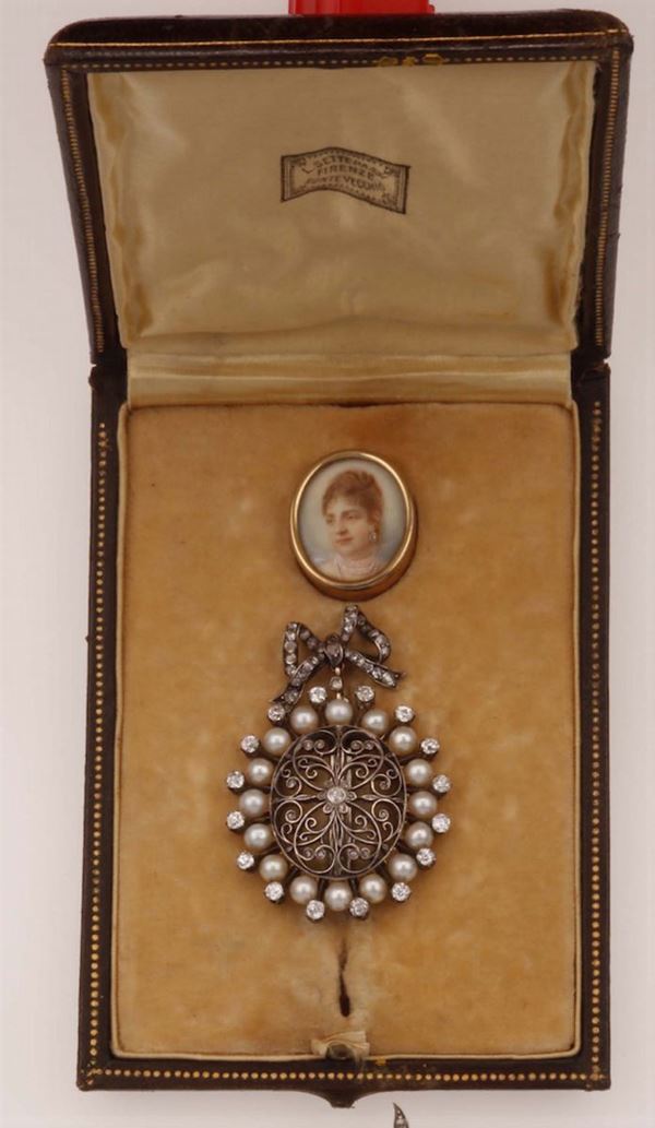 A locket in platinum set with diamonds and natural pearls containing a miniature of Queen Margherita of Savoy. Italy, 19th century. Settepassi