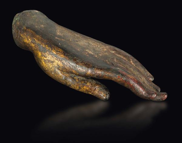 A bronze Buddha's hand with traces of gilt, China, Ming Dynasty, 15th century