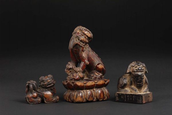 Three carved wood Pho dogs, one is a seal, China, Qing Dynasty, 19th century