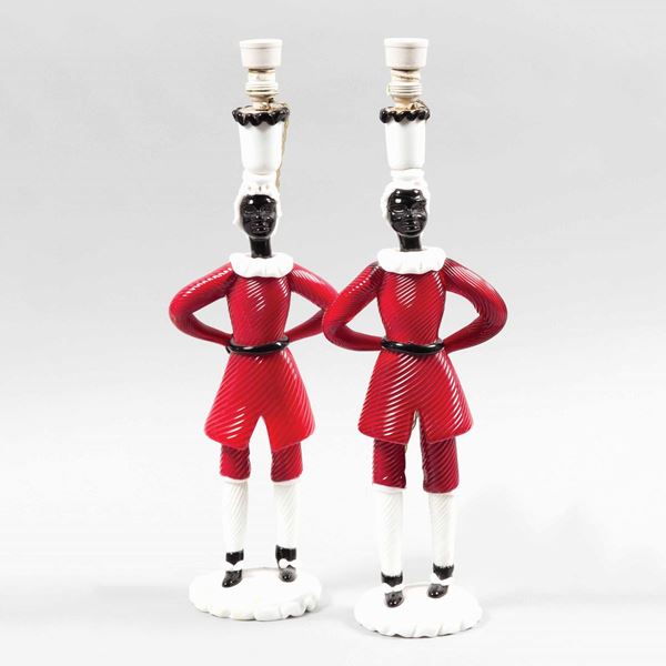 Fulvio Bianconi, Venini, Murano, 1948 ca. A pair of figurines in red glass, milk glass and black glass, depicting "Mori" holding candles.