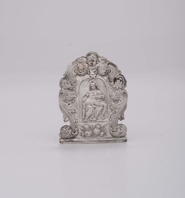 A Baroque peace in embossed and chiselled silver, depicting a Pietà, Venice, 17th century (marks of a lion in moleca, of the silversmith and the assayer).