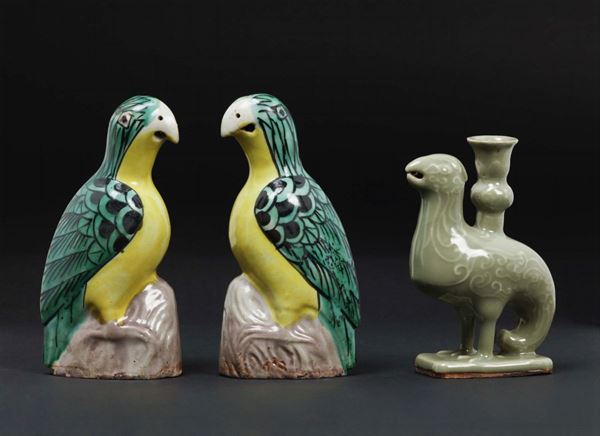 Lot of polychrome and Celadon enammeled porcelain two parrots and a candlestick, China, Qing Dynasty, 18th century