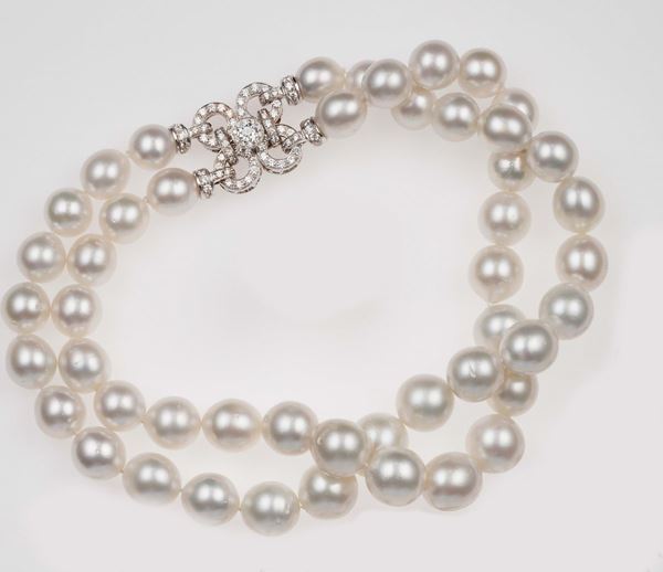 Two-row of cultured pearl necklace with a diamond and gold clasp
