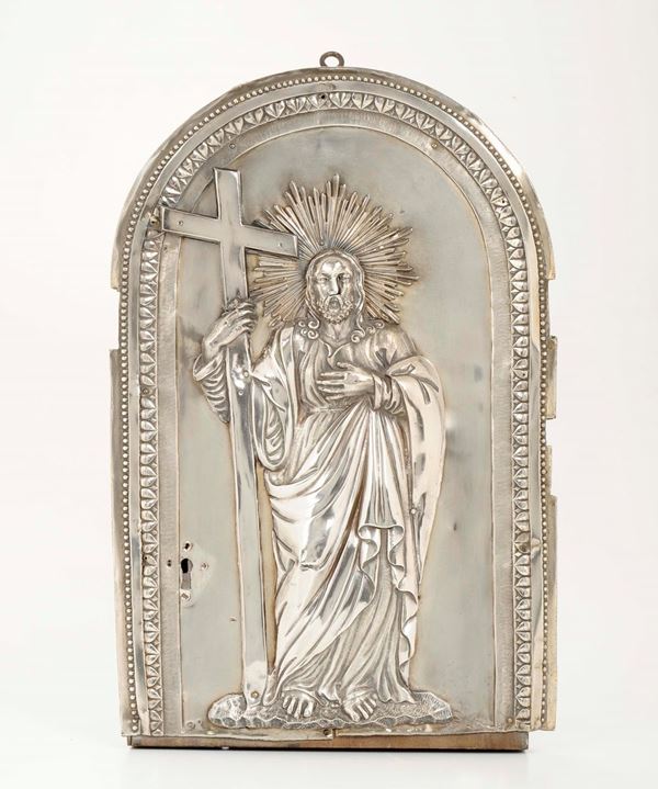 A tabernacle door in embossed and chiselled silver on a wooden structure. Punches for Genova, in use from 1825 to 1872 (cross of saints Maurice and Lazarus and dolphin) and for silversmith A°S (unidentified)
