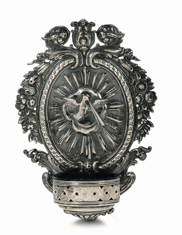 A holy water font in embossed and chiselled silver, glass, Genova, second half of the 18th century