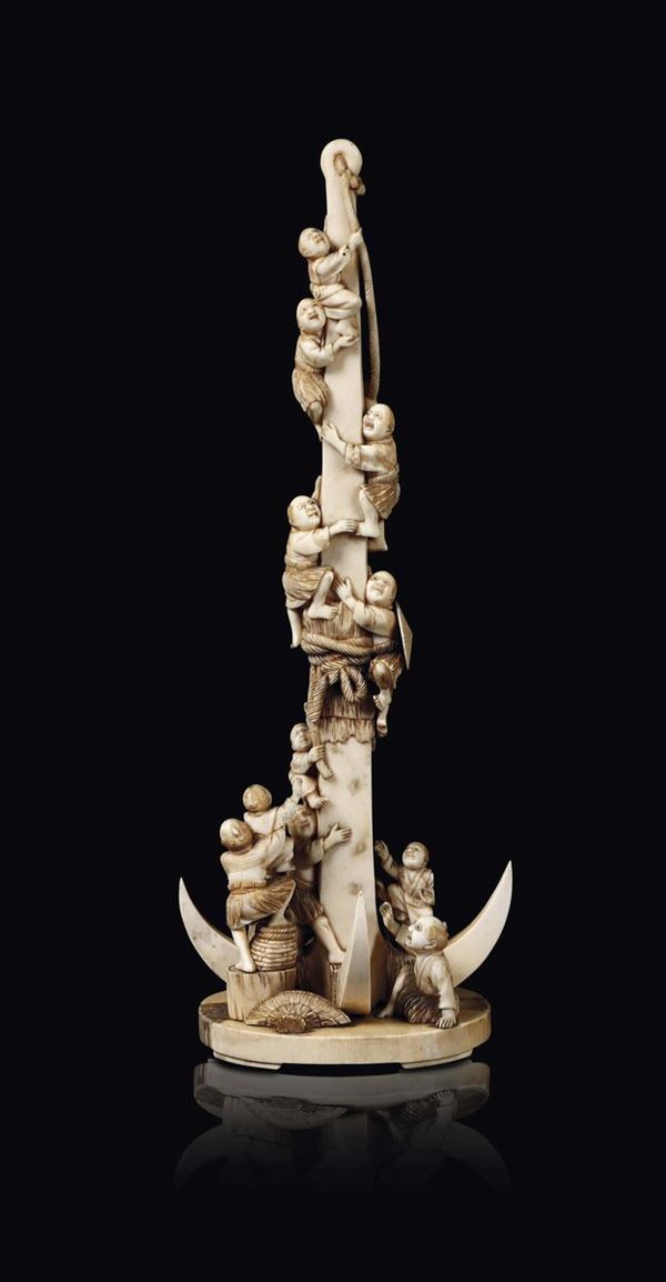 A carved ivory group with figures climbing a stuffed tree, China, early 20th century
