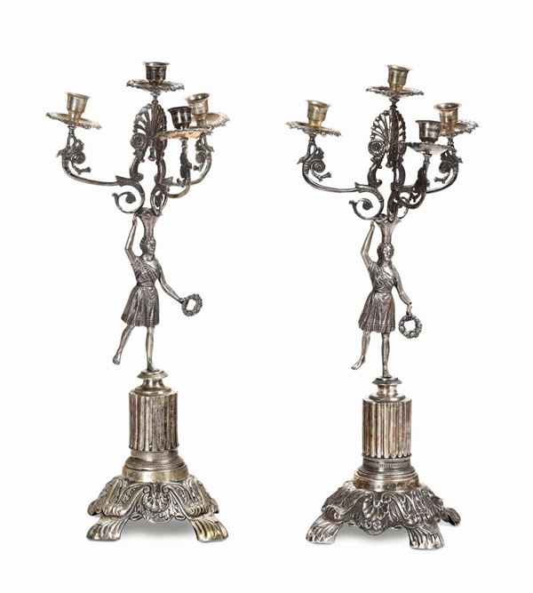 A pair of four-lamp silver candlesticks, silversmith AB