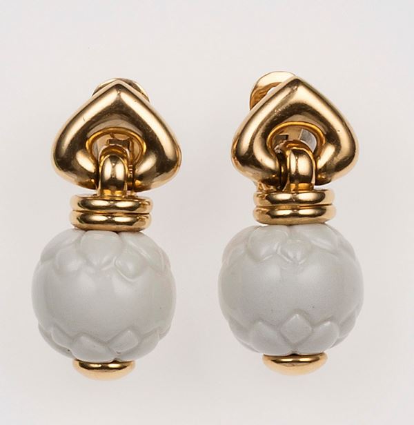 Pair of white ceramic and gold earrings. Bulgari