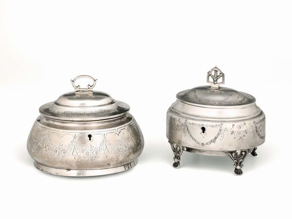 Two sugar pots in molten, embossed and chiselled silver, with locks, Vienna 19-20th century. Title stamps in use from 1866 to 1922 and unidentified marks for silversmiths VC and JK