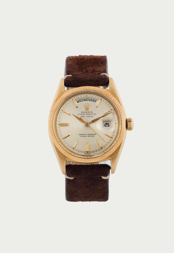 ROLEX, Oyster Perpetual, Day-Date, Superlative Chronometer, Officially Certified,  case No. 328868, Ref. 6611. Fine and extremely rare, tonneau-shaped, center seconds, self-winding, water-resistant, 18K yellow gold wristwatch with day and date and an 18K  gold plated buckle. Made in 1957.