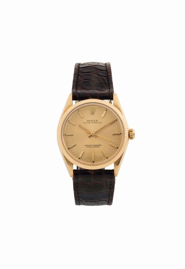 ROLEX, Oyster Perpetual, Superlative Chronometer, Officially Certified, case No. 1273003, Ref. 1005.  Fine, center seconds, self-winding, water-resistant, 18K yellow gold wristwatch with gold plated Rolex buckle. Made circa 1965