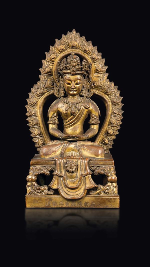 A gilt bronze figure of Amitayus with aura, China, Qing Dynasty, Qianlong Mark and of the Period (1736-1795)