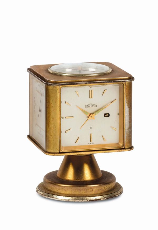 Angelus, desk Weather Station. Fine, gilt brass, four-dialed, eight-day going, keyless revolving desk timepiece with date, hygrometer, barometer and thermometer in Fahrenheit and Centigrade. Made circa 1970