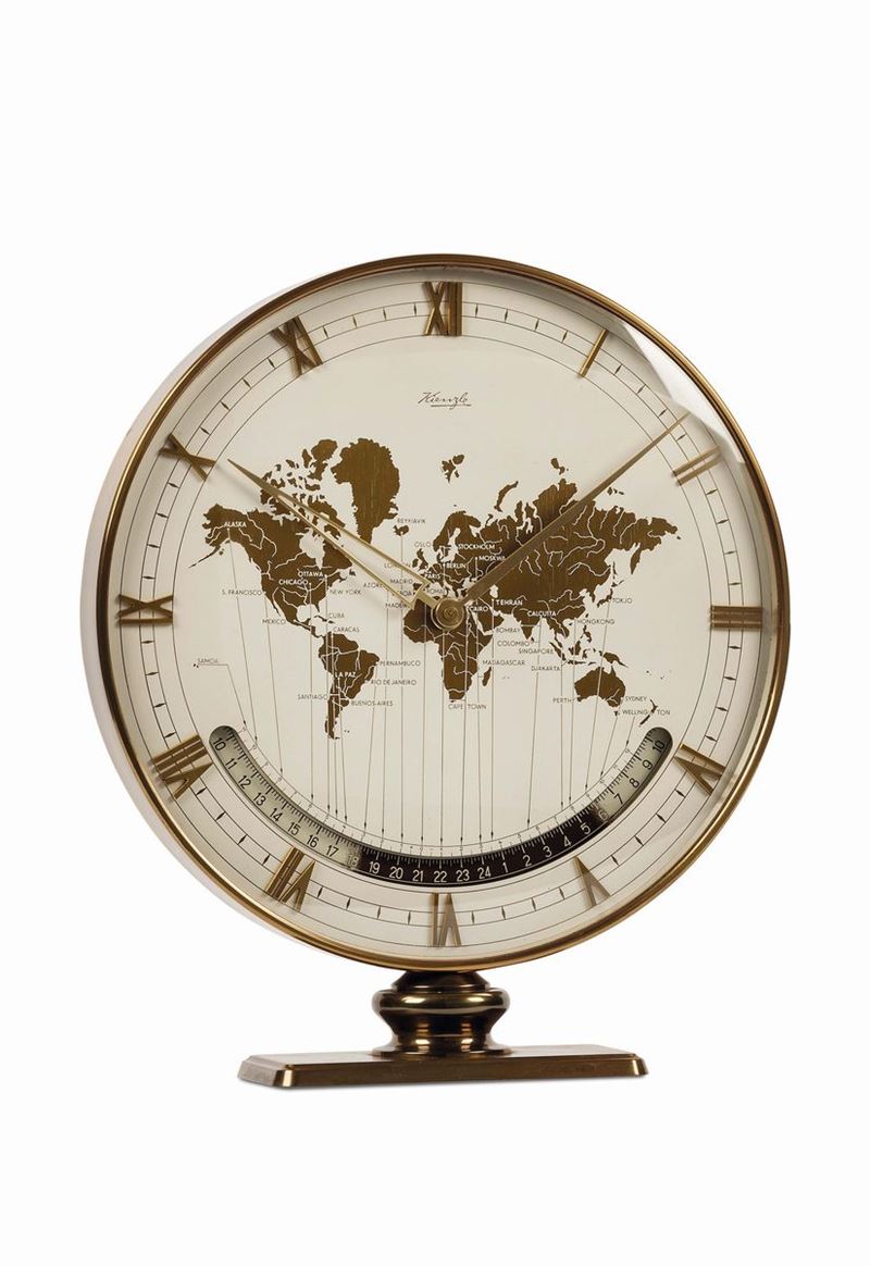 KIENZLE, World Time gilt brass Desk Clock, orologio in ottone dorato, con ore del mondo, apertura per le 24 ore e indicazione del giorno e della notte. Realizzato nel 1950 circa  - Asta Orologi da Polso e da Tasca - Cambi Casa d'Aste